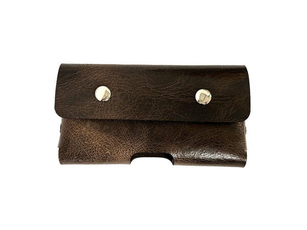 Brown leather holster with silver buttons on a white background